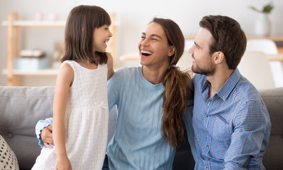 Daughter having fun with parents.