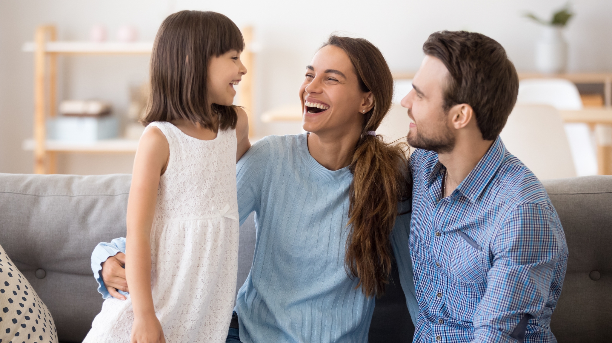 Daughter having fun with parents.