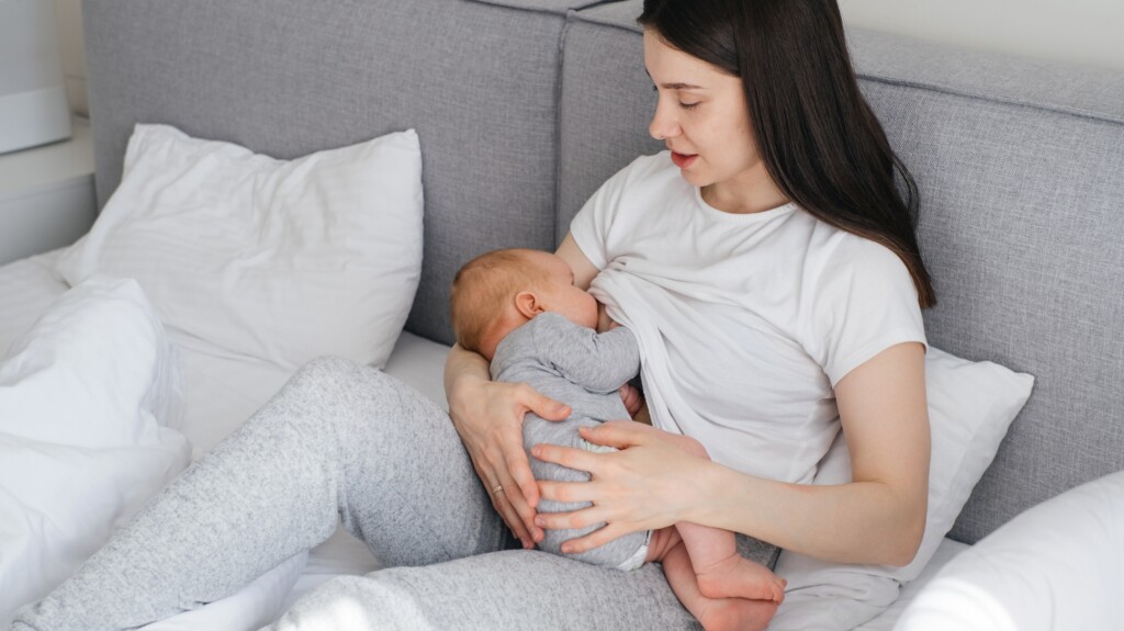 Mother giving breastmilk to baby