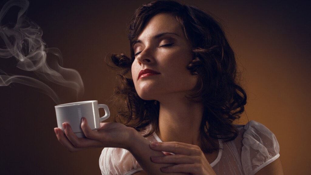 women holding coffee.