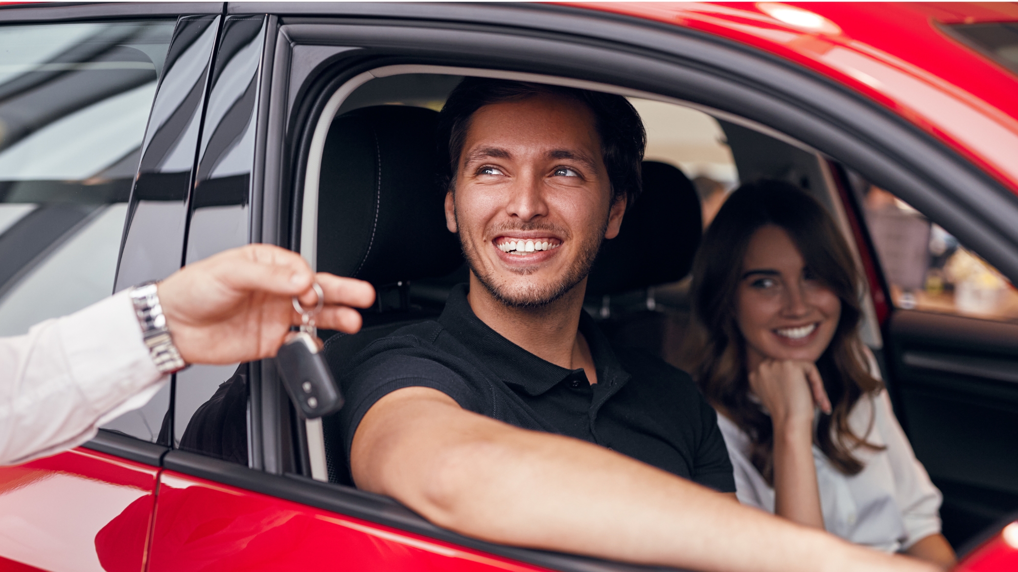 Happy couple renting car together.